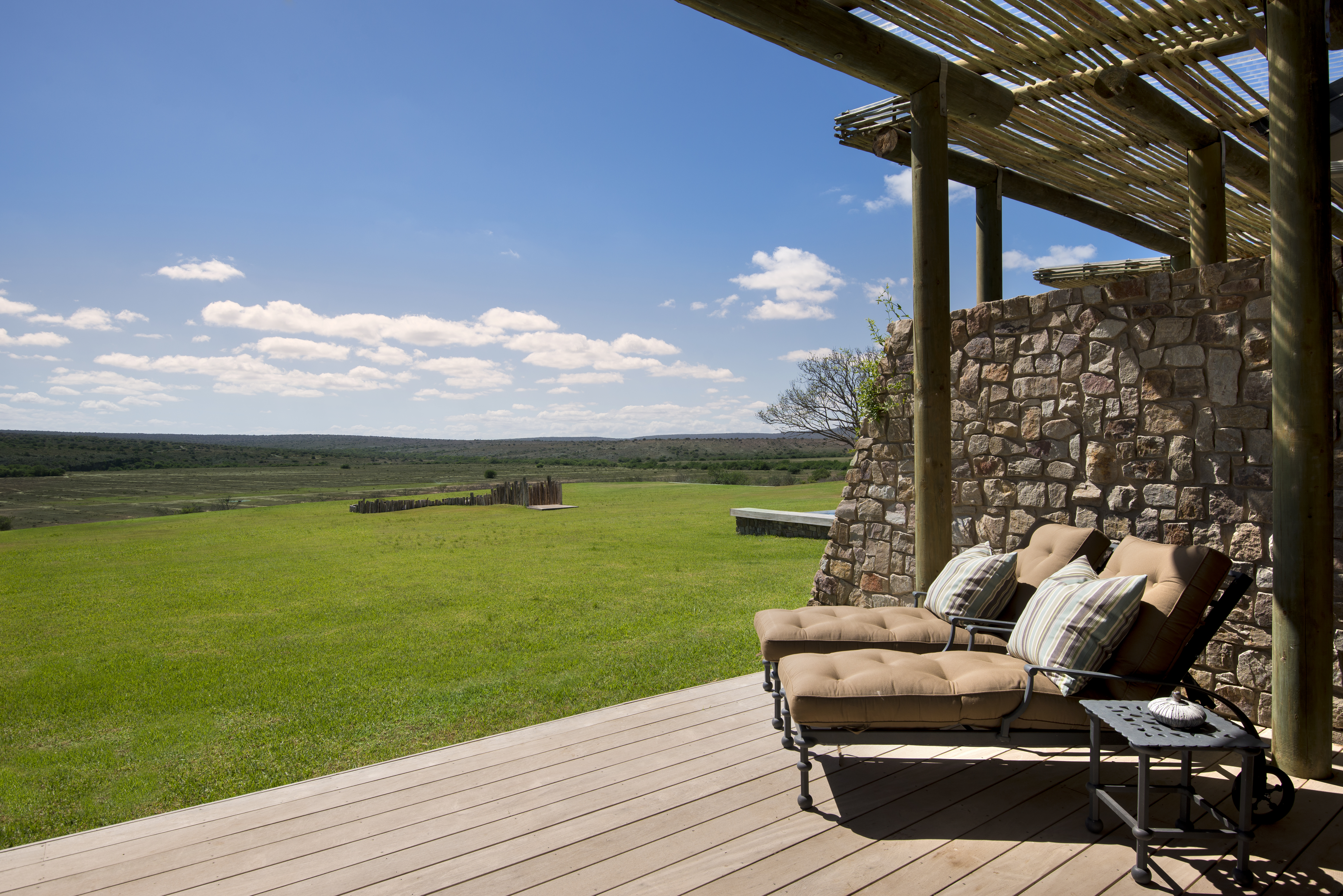 Relax on your private terrace watching wildlife wander by as they make their way to the nearby watering hole