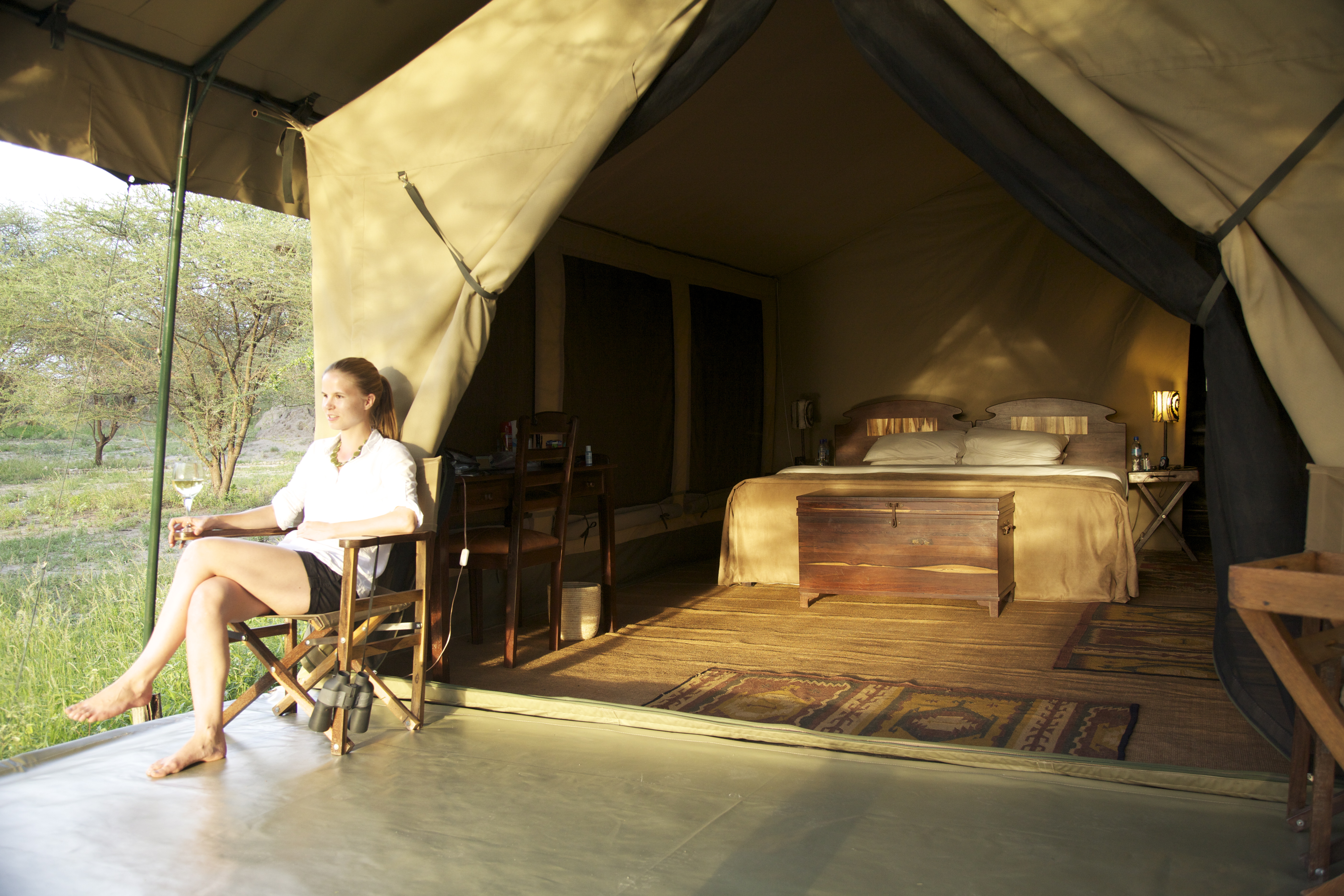 Enjoying a drink by one of 6 guest tents
