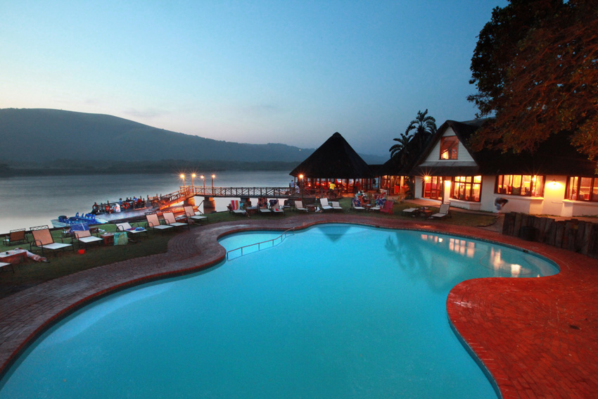 Early evening view looking down over pool and bar deck