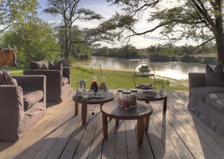 Guest areas boast views of the river and its resident hippo