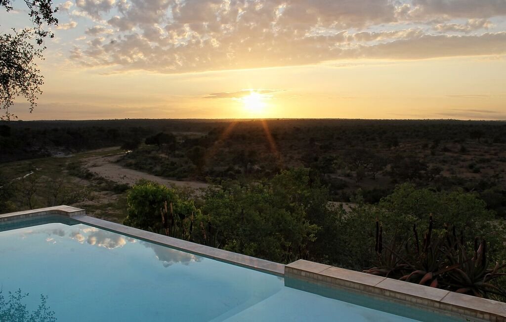 Watch an amazing sunset over the Klaserie from the cool comfort of the rim flow swimming pool