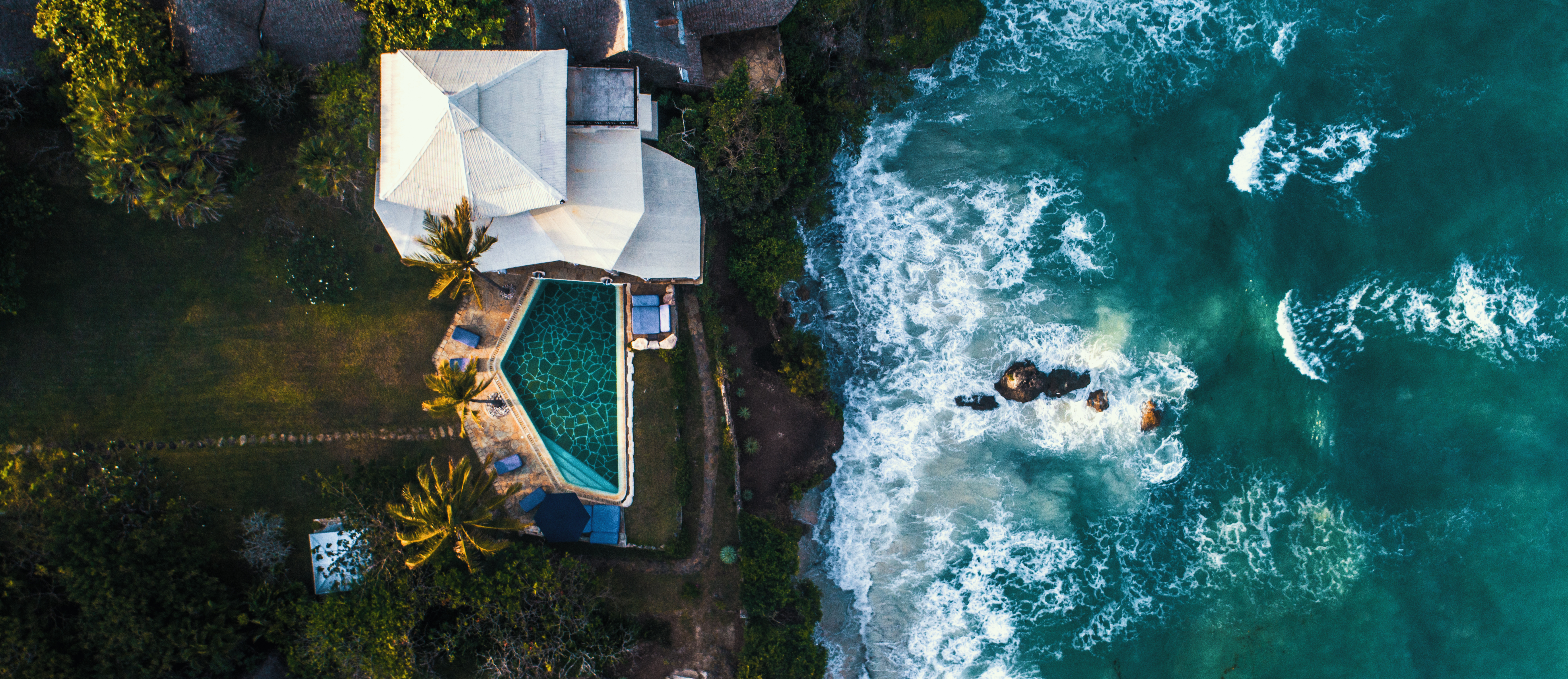Aerial view of cliff villa at high tide