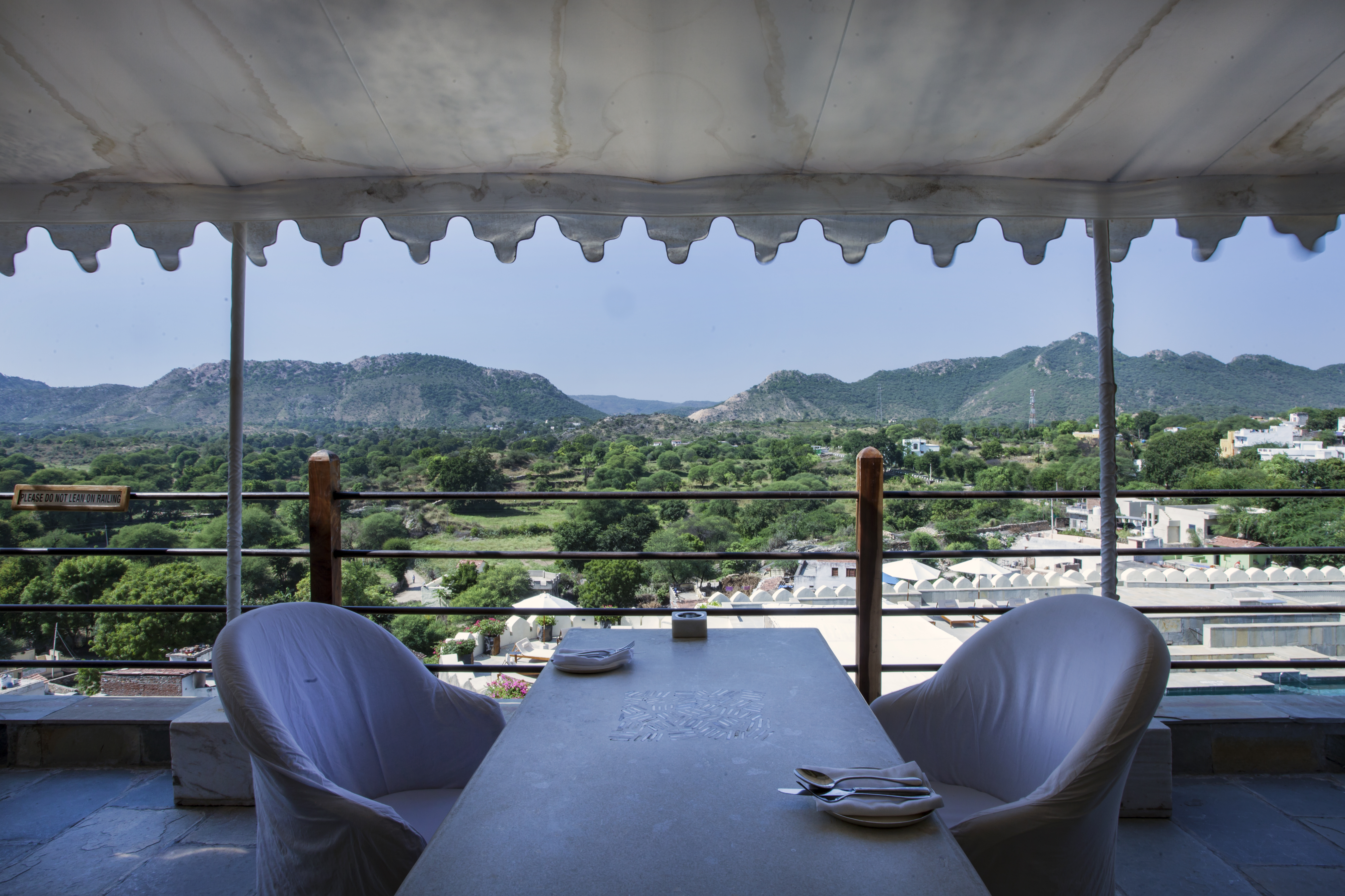 Restaurant seating extended outside with canopy and Mudda seating