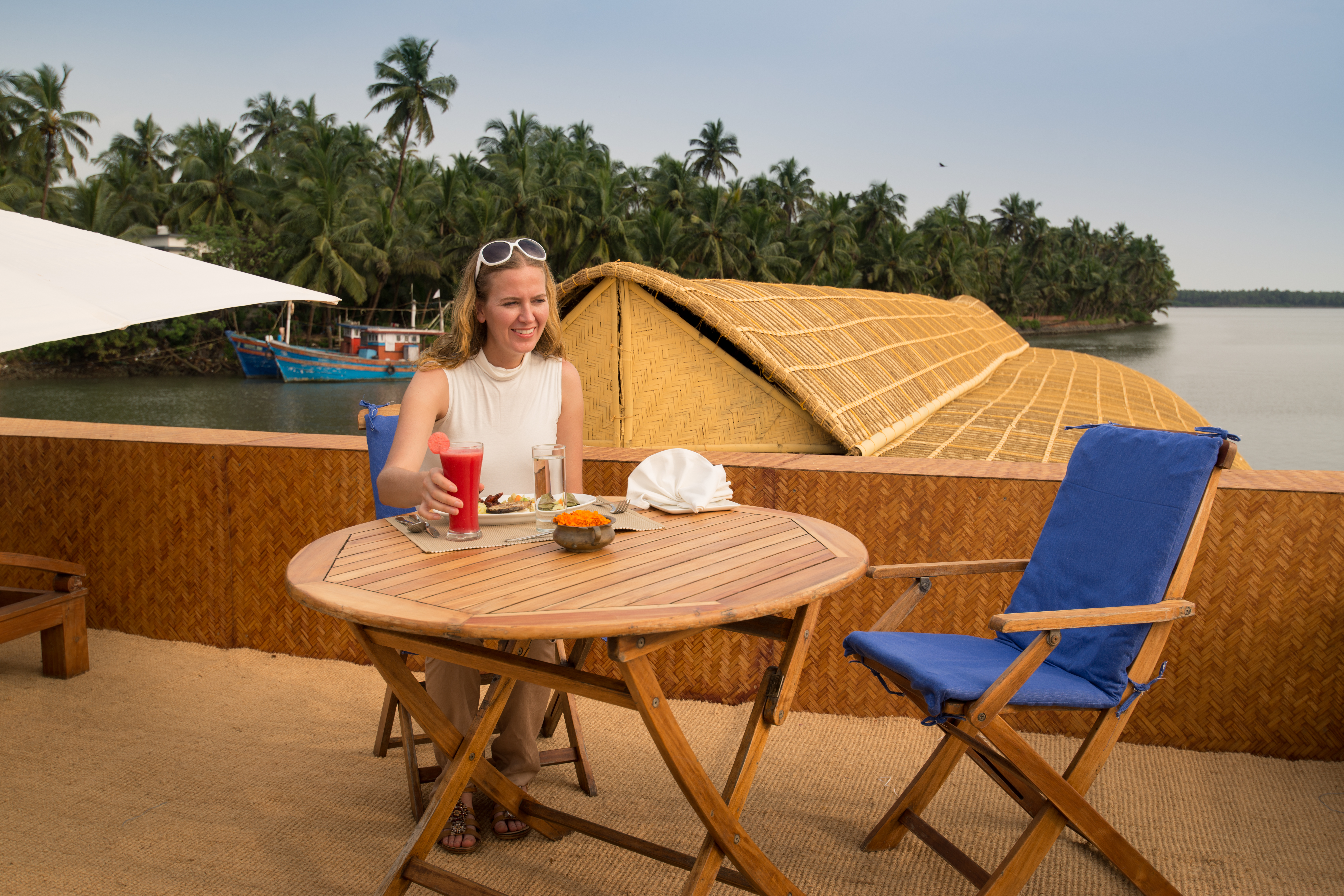 Guest enjoying her drink at the Houseboat