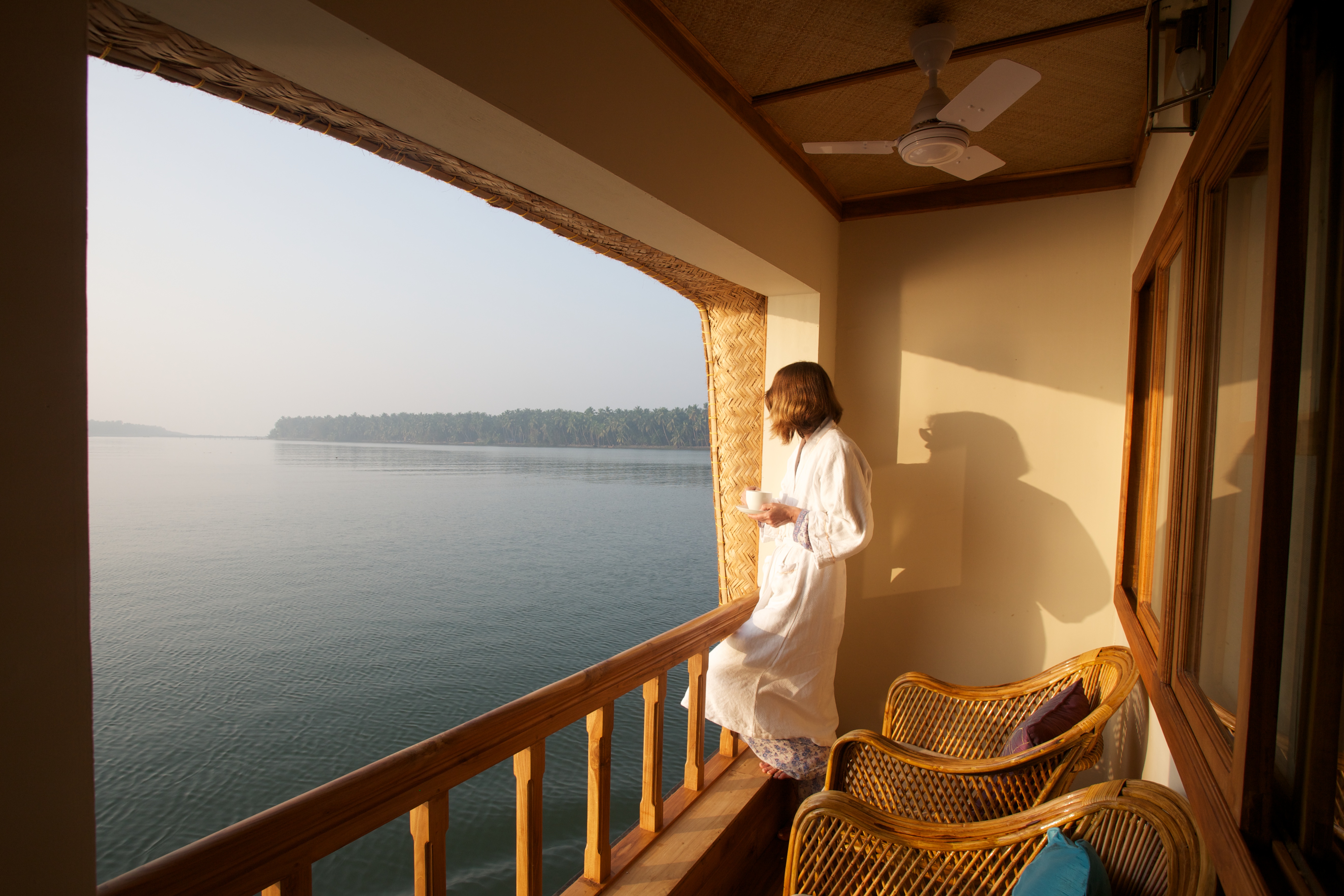 Guest relaxing in the private balcony of their room