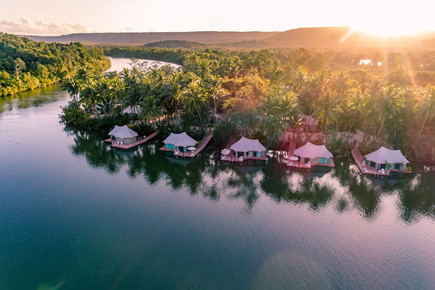 exotic holiday floating tents and tropical sunset
