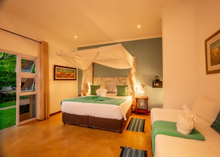 Convertible between 1 double and 1 single or 3 single beds, the triple deluxe room is spacious with mosquito nets, air-conditioning and an en suite bathroom.