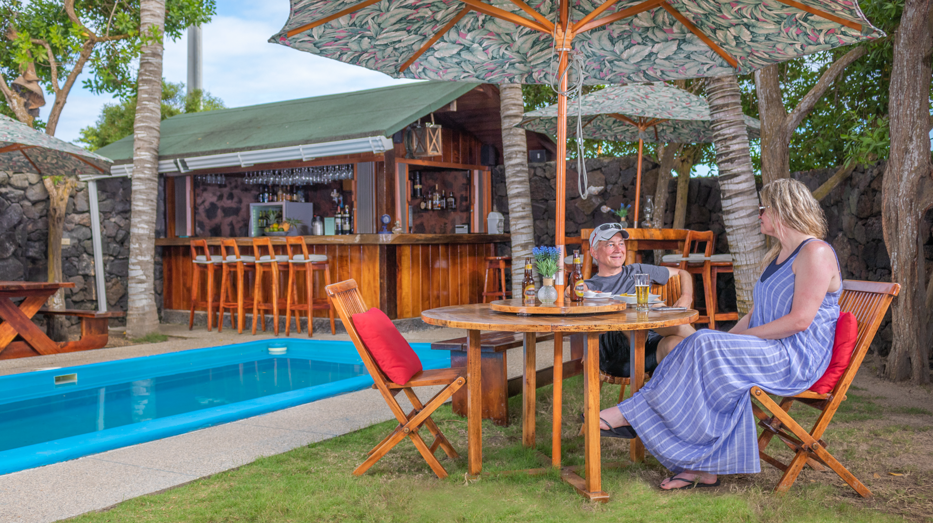 In front of the pool, bar and relaxing chairs 
