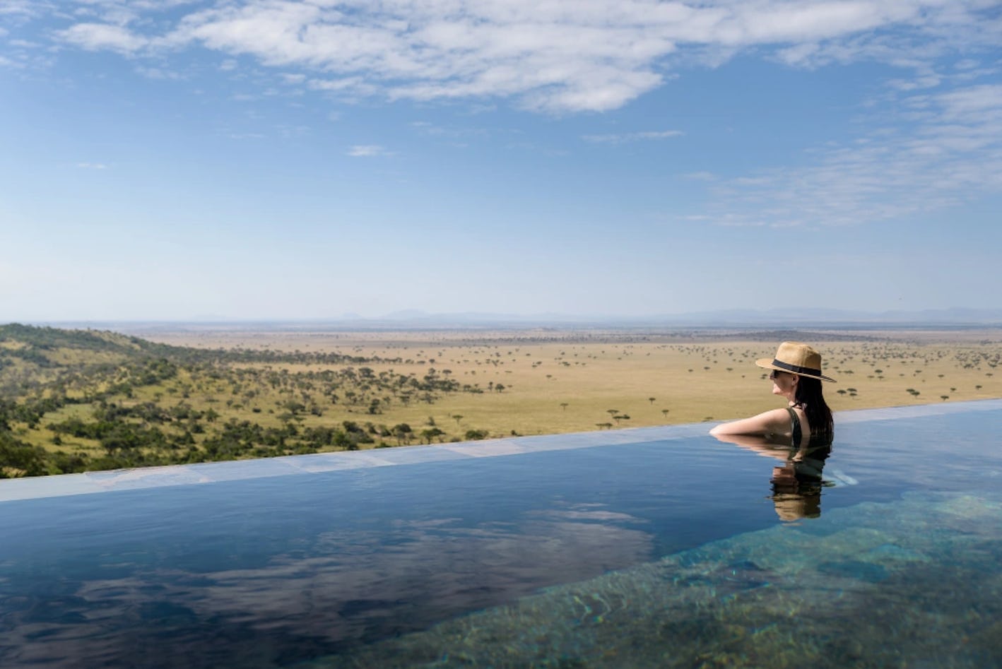 Hillside Suite Guest in pool overlooking Serengeti Adriaan Louw.